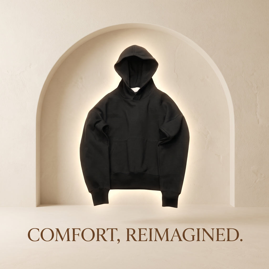 Black HOODÉRA hoodie in a cream arch. Comfort, Reimagined.
