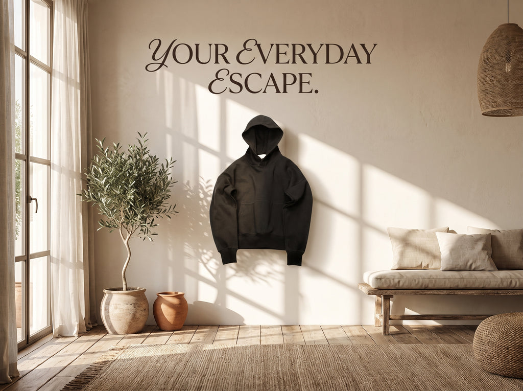 Black hoodie in a sunlit cream living room.