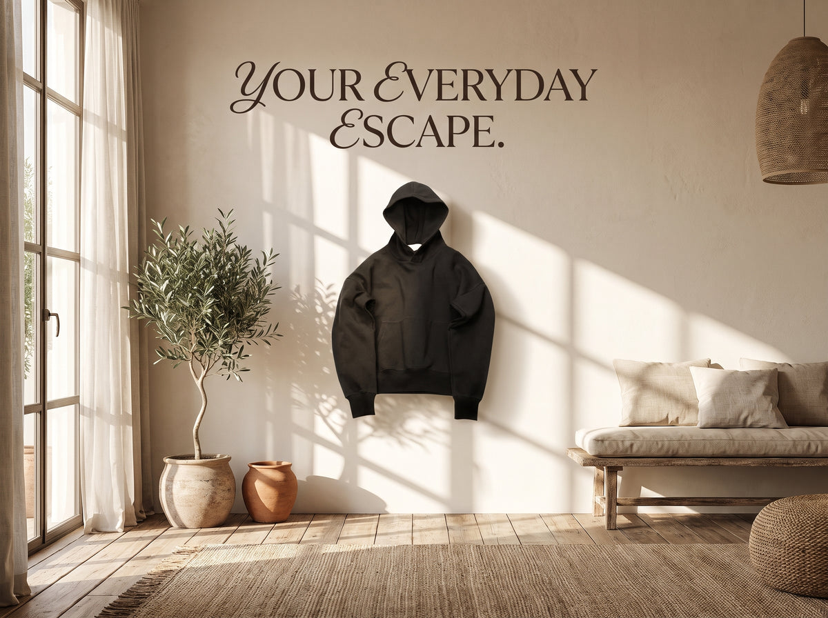 Black hoodie in a sunlit cream living room.