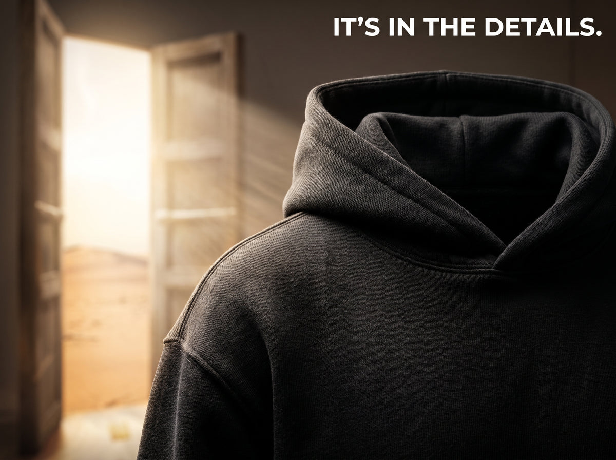 Close-up of black hoodie hood, neckline and fabric.